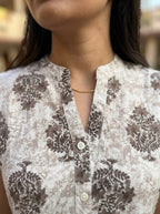 Beige Floral Cotton Sleeveless Peplum Top